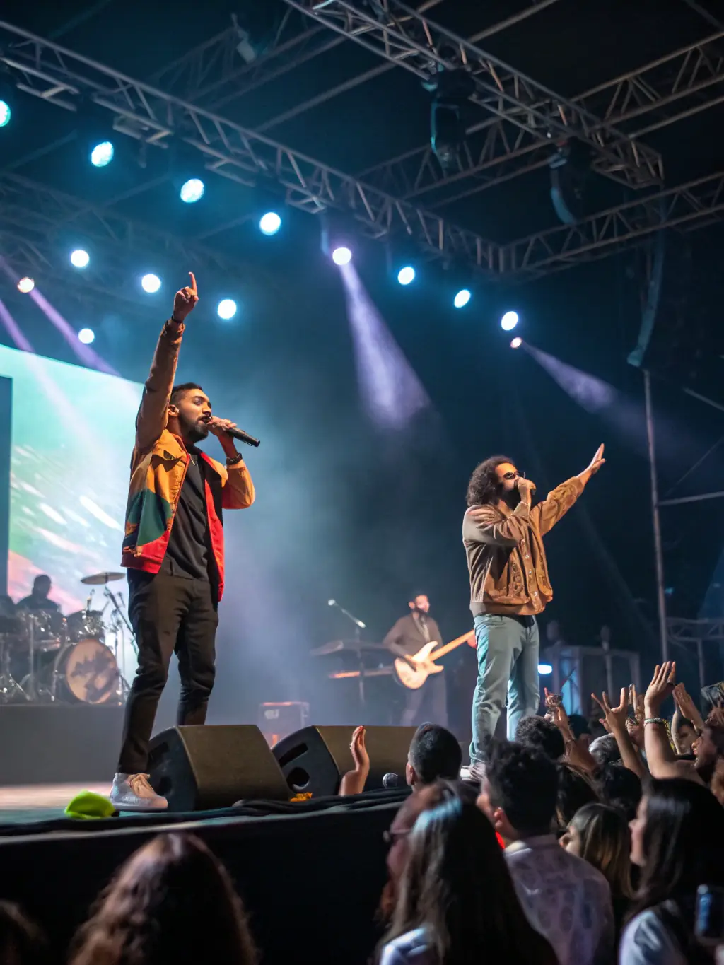 A dynamic image of artists performing on stage with professional lighting and sound equipment, capturing the energy and creativity of live performances supported by NO FUEL.